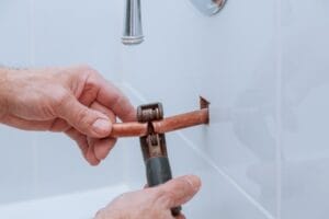 copper pipe cutting in bathroom Plumbers Network.jpg  